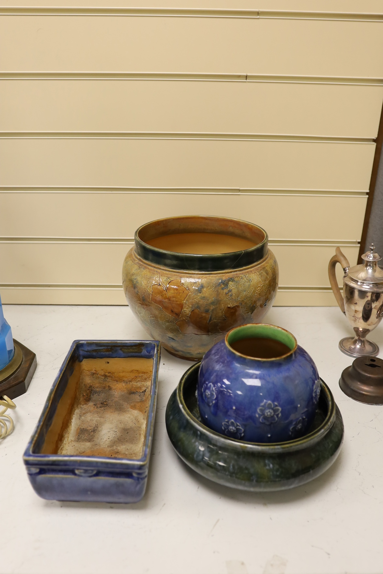 A Royal Doulton jardiniere, a bowl, a vase and a planter, largest 28cm in diameter (4) Condition - jardiniere poor, others good